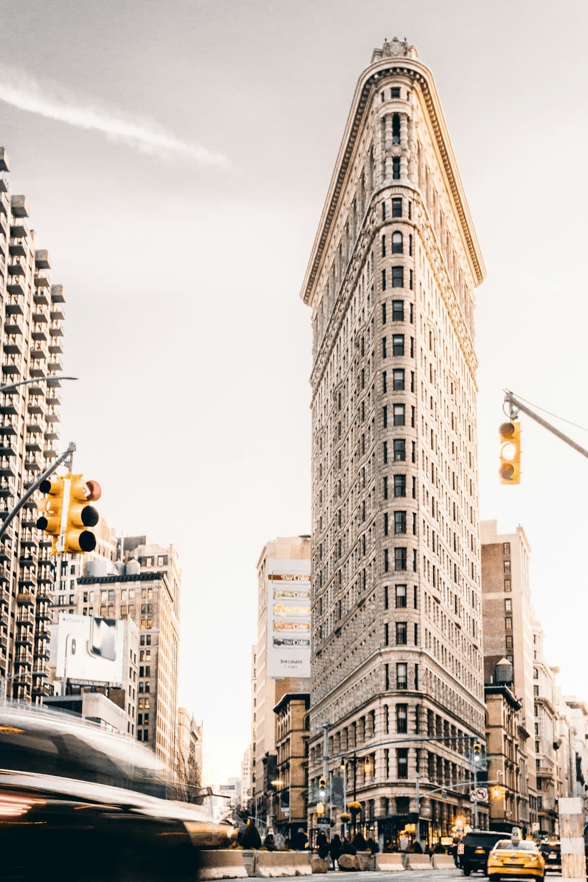 Flatiron Building in Chelsea, Manhattan with golden light and yellow cabs